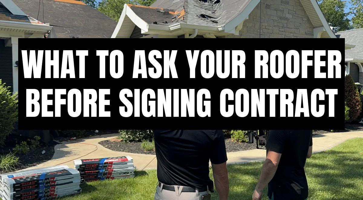Two roofers inspect storm-damaged home in St. Louis with text overlay: What To Ask Your Roofer Before Signing Contract