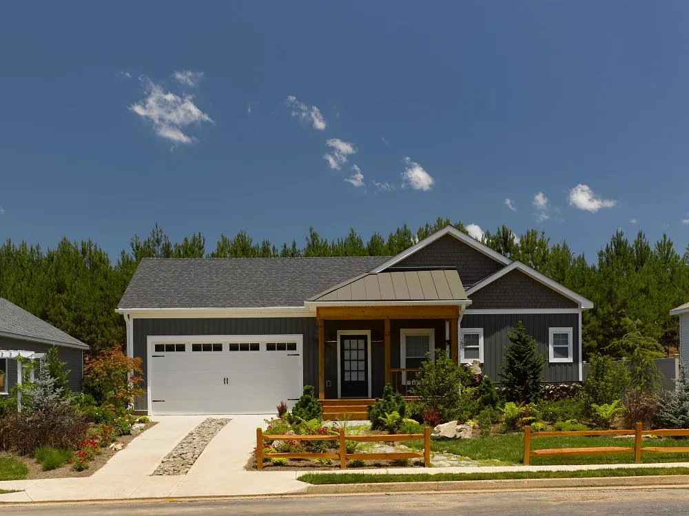 Craftsman-style home with gray siding and asphalt shingle roof