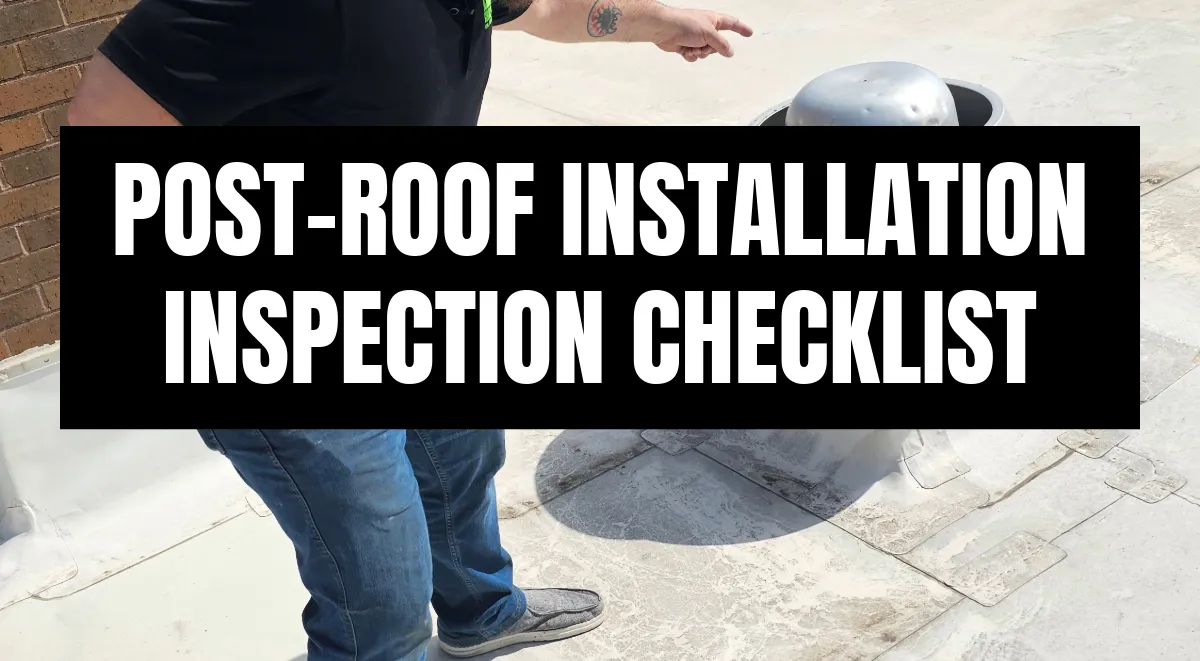 Roofing inspector pointing at a flat roof vent during a post-installation inspection in St. Louis, MO.