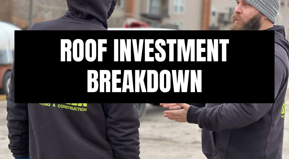 Two roofing contractors in branded hoodies discuss a roof investment breakdown outdoors in St. Louis.